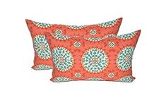 two red and blue decorative pillows on a white background, one with an orange flower pattern