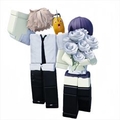 two figurines that are holding flowers in their hands