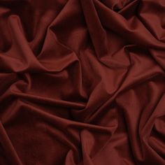 an image of a red cloth textured with fabric material that is very soft and smooth