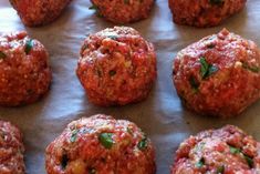 raw meatballs on a baking sheet ready to go into the oven for dinner or as an appetizer