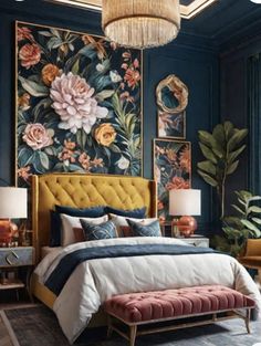 a bedroom decorated in blue and gold with flowers on the wall, chandelier