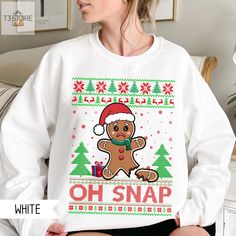 Bring humor to your holiday wardrobe with our Oh Snap Gingerbread Sweatshirt! Featuring a funny broken gingerbread cookie design, this playful Christmas shirt is perfect for adding a quirky touch to the festivities. Whether you're at an ugly sweater party or spreading holiday cheer with friends, this comfy shirt is sure to get some laughs. A fun and festive choice for those who love a good holiday pun! Hightlight information: Due to listing limitations, we cannot display all the colors of the shop's shirts. If you want to choose another beside the available color listing, please contact us. The shop is available to serve you. Welcome to T3StoreByTuan! We're thrilled to have you here. Whether you're shopping for yourself or looking for the perfect gift, we offer three shirt products to suit Gingerbread Sweatshirt, Holiday Puns, Christmas Prep, Oh Snap, Gingerbread Cookie, Ugly Sweater Party, Comfy Shirts, Holiday Wardrobe, Sweatshirt Christmas