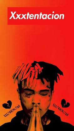 a man with his hands together in front of his face and the words xxxtentaction above him