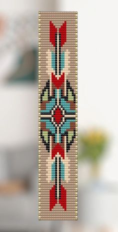 a cross stitch pattern hanging from the ceiling