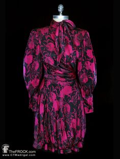 "BIG NEWS After 22 years, our website, TheFROCK.com, has had a makeover. Check out the new site, and join our mailing list for new arrivals.  Ungaro, Parallèle black and magenta floral silk day or evening dress with pussybow neck and semi-bubble hem. Removable shoulder pads, zippered sleeve cuffs, rear dress zipper, georgette and habotai liners. Measures bust 37\", waist 27\", length 40\", sleeve length 25\" (darted wrist is fitted in the manner of a bishop sleeve so it will fit all shorter slee Bow Dresses, French Couture, Silk Cocktail Dress, Emanuel Ungaro, Vintage Fur, Bishop Sleeve, Dress Zipper, Dress Clothes For Women, Pink Red