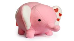 a pink stuffed elephant with hearts on it's back