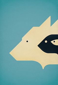 an animal's head is shown in the shape of a bear and fish, against a blue background