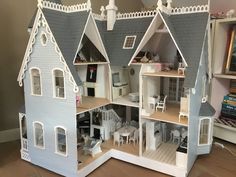 a doll house with all the furniture and accessories