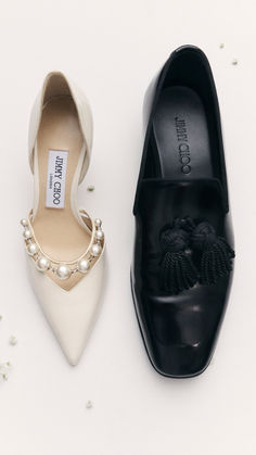 two pairs of black and white shoes with pearls