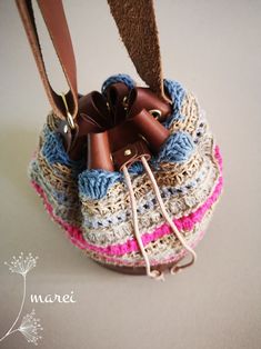 Petite Raspberry - our series of bucket bags.  This colorful and beautiful bucket bag is a combination of knitwear, crochet, and leather. The creation has a cylindrical-shaped leather base that gives solidity to the whole frame of the bag. The bag is fully hand-knitted and hand-sewn. We use natural jute twines of different sizes to ensure further steadiness of our knitwear. Despite the bucket bag's small size, it still provides enough space for basic items. Bag Dimensions:  Leather Base: flat (for stability) Leather Base Diameter: 16-17 cm / 6.3-6.7 in Height: 20 cm / 7.9 in (height of the knitwear: 13-14 cm / 5.1-5.5 in) Strap Type: unstitched, a single layer Strap Width: 2.5 cm / 0.98 in Strap Length: apprx 140 cm / 55 in Materials Used: *Georgian natural cow leather (leather is soft and Spring Leather Handles Crochet Bucket Bag, Beige Crochet Bucket Bag With Leather Handles, Natural Leather Crochet Bucket Bag, Natural Crochet Bucket Bag With Adjustable Strap, Eco-friendly Crochet Bucket Bag With Adjustable Strap, Crochet Bucket Bag, Leather Crochet, Bucket Purse, Yarn Accessories