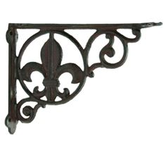 an iron shelf bracket with fleur de lis on it