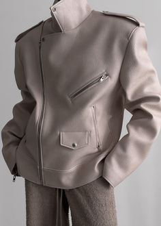 Color: Cream Grained relaxed faux leather Oversized moto jacket Notch lapels Three zip pockets Snap epaulettes Front zip closure Lined 100% Polyurethane Dry Clean By The Frankie Shop. Imported One Size Oversized Biker Jacket, The Frankie Shop, Frankie Shop, Leather Biker Jacket, Moto Jacket, Biker Jacket, Vegan Leather, Zip Pockets, Chicago