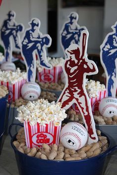 some baseball themed treats are in buckets