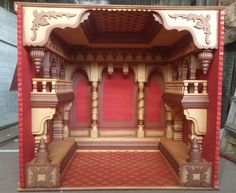 an elaborately designed wooden structure with red walls