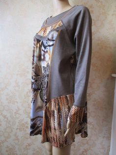 "Plus size dress in brown with an abstract pattern in blue\\yellow\\brown.  It has a high round neck and long sleeves,  the material is quite thick so ideal for autumn\\winter. Bust, pit to pit;  20\" Inside sleeve;  23\" Length;  31\" Made by  S'QUISES 65% polyester  30% viscose  5% elastin" Fitted Brown Long Sleeve Dress For Fall, Fitted Long Sleeve Brown Dress For Fall, Retro Beige Long Sleeve Dress, Brown Long Sleeve Patchwork Dresses, Retro Brown Dress For Fall, Patterned Long Sleeve Fall Dresses, Patterned Long Sleeve Dresses For Fall, Brown Long Sleeve Dress For Fall, Patterned Patchwork Long-sleeve Dresses