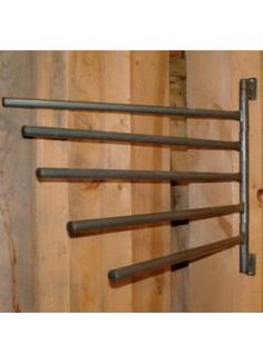 an image of a metal rack with six bars hanging from it's sides on a wooden wall