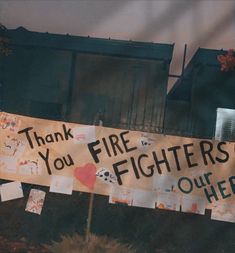 a sign that says thank you fire fighters out there with pictures and hearts on it