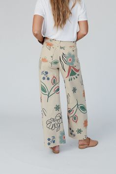 You'll love the unique and special print of the Toscana Printed Wide Leg Pants! You're going to want to rock these adorable pants with all your cute boho tops because they feature: Comfortable stretch denim fabric with so cute hand-drawn-inspired print throughout Flattering wide leg silhouette Classic high-rise waistline with a zipper-fly closure Convenient side and back patch pockets and belt loops Pair with: Tricks Up Her Sleeve Sweater, Mulholland Draped Cardigan, and Kapalua Bay Adjustable T Multicolor Wide Leg Cotton Jeans, Multicolor Wide-leg Cotton Jeans, Non-stretch Wide Leg Jeans With Floral Print, Non-stretch Floral Print Wide Leg Jeans, Non-stretch Wide Leg Floral Print Jeans, Non-stretch Wide Leg Floral Jeans, Floral Print Non-stretch Wide Leg Jeans, Summer Festival Wide Leg Jeans, Wide Leg Summer Festival Jeans