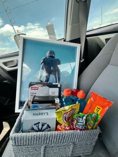 the back seat of a car filled with snacks