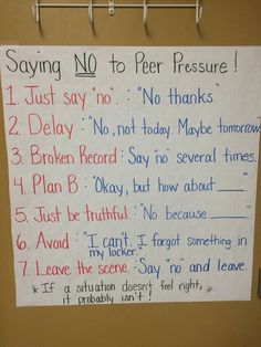 a sign posted on a bulletin board that says saying no to peer pressure just say no thanks