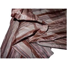 the fabric is striped and has been folded up to show it's folds, which are