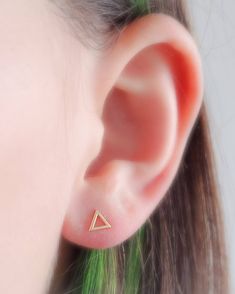 "Modern simplicity. These 14 karat gold, open triangle studs are casual and easy. Great for workdays or weekends. * T H E * D E T A I L S * * All components are solid 14 karat gold * Triangle measures 5mm * Post measures 9mm long * Thoughtfully packaged & ready for gift giving! * Handmade, just for you, in our sunny California Studio * Our 365 Guarantee: Our jewelry is guaranteed for 1 year after purchase date against defects. * Your jewelry is always beautifully and carefully wrapped in a s Minimalist Triangle Jewelry For Pierced Ears, Minimalist Triangle Jewelry, Sterling Silver Triangle Earrings For Pierced Ears, Everyday Gold Triangle Earrings, Minimalist Triangle Jewelry For Anniversary, Everyday Triangle Nickel-free Jewelry, Gold Triangle Jewelry For Anniversary, 14k Gold Triangle Jewelry, 14k Gold Triangle Shaped Jewelry