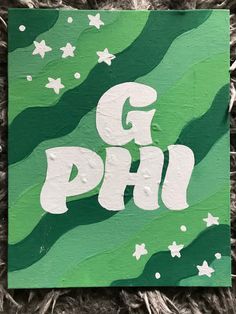 a green and white painting with the word g p h written in white on it