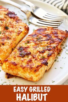 two grilled halibut on a white plate with a fork