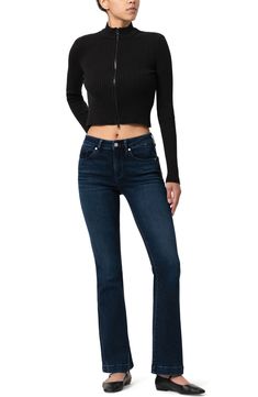 Add a vintage-chic vibe to your casual looks with stretchy, curve-hugging flared jeans featuring trouser-style hems and a polished dark wash. 21 1/2" leg opening; 9 1/2" front rise; 15" back rise Zip fly with button closure Five-pocket style 56% cotton, 15% recycled polyester, 14% recycled cotton, 11% Tencel® modal, 2% polyester, 2% elastane Tencel modal is a more-sustainably produced fiber made with closed-loop processing and is certified with the EU Ecolabel as having a low environmental impac Dark Wash Flared Hem Flares For Fall, Fall Flare Jeans With Five Pockets, Mid-rise Blue Flares For Fall, Trendy Fall Flare Jeans With Elastane, Chic Fitted Jeans With Flared Hem, Fitted Jeans With Flared Hem For Fall, Fall Dark Wash Flared Hem Flares, Mid-rise Dark Wash Flare Jeans With Zipper, Mid-rise Dark Wash Flare Jeans With Contrast Stitching