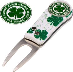 a pair of scissors with shamrocks on it