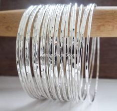 Stacking Bangle in Sterling Silver, Sterling Silver Bangle Set, Set of 7 Bangles, Thin Stacking, Bangles, Silver Bracelet Set, 7 Day Bangles Description Metal :- 925 Sterling Silver Style : Bangle/Bracelet Theme : Wedding Party Gemstone:- no Occasion : Birthday Events, Lovely Valentine's Day Gift, Anniversary Gift, Weeding Gift, Engagement Ring, Lover Gift Ring, Hen Party And Other Occasion.... Your order will be handmade and ready for shipment in 1 to 2 business days This stunning and elegant set of 7 bangles are individually handmade in India. Handcrafted to the highest quality with a hammer finish from 3mm solid half round wire, they are polished and Sterling silver. They make a lovely tune when they jangle together! Stacking Bangles, Hammered Bangles, Boho Bangle, Handmade Silver Jewellery, Bracelet Set Silver, Stackable Bangles, The Bangles, Bangles Making, Sterling Silver Bangle