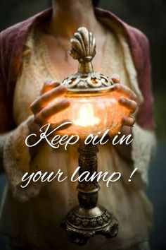 a woman holding a lamp in her hands with the words keep out in your lamp