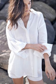 The Lilo Shirt is a timeless classic, crafted from lightweight fabric with a captivating texture reminiscent of rippled water. Whether you're unwinding at home or embarking on a beach trip, you can effortlessly style it as a sleep dress, an oversized blouse, or a breezy cover-up. Oversized fit Drop shoulder Button up High-low hemline Semi-sheer Runs large Beachwear Long Sleeve Relaxed Fit Blouse, Relaxed Fit Long Sleeve Beachwear Blouse, Long Sleeve Beachwear Blouse With Relaxed Fit, Relaxed Long Sleeve Shirt For Vacation, Relaxed Long Sleeve Beach Shirt, Effortless Long Sleeve Beach Blouse, Effortless Relaxed Fit Beach Blouse, Effortless Long Sleeve Blouse For Beach, Effortless Relaxed Fit Beach Shirt