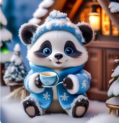 a panda bear figurine holding a cup of coffee in front of a christmas scene