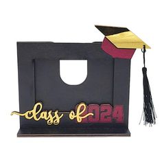 a black bag with a graduation cap and tassell on the top that says class of 1934