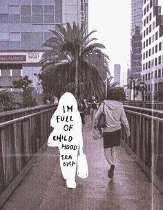 a person walking across a bridge with the words i'm full of child hoods