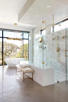 an elegant bathroom with marble floors and walls