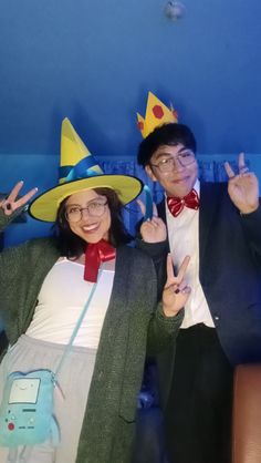 a man and woman dressed up in costumes