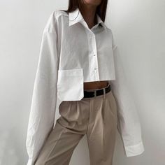 This Cropped Navel Short White Shirt is perfect for any summer wardrobe. Its lightweight material is soft and breathable, while its curved hem adds a stylish and relaxed fit. Its classic white color ensures versatility, and its unique cropped cut pairs perfectly with high-waisted jeans or shorts.