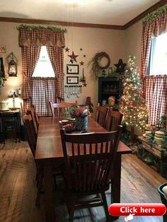 the dining room is decorated for christmas with holiday decorations on the walls and around the table