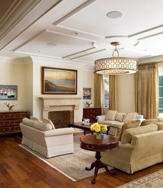 a living room filled with furniture and a fire place in the middle of a room