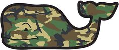 a green and brown camo whale shaped object with a smiling face on it's side