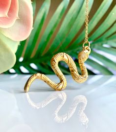 Gold Snake Necklace Alluring textured Turkish snake pendant necklace on a 14k gold chain Pendant: 2" Long Necklace: 12" Long in total Your necklace will arrive gift-wrapped! View more pendant necklaces!--> http://etsy.me/2lVN92R Shop Lauren Alleyne Jewelry on Etsy!--> http://etsy.me/2eFm9mK Gold Snake Necklace, Snake Pendant Necklace, Snake Jewelry, Gold Snake Charms, Serpent Charm Gold Snake Necklace, Gold Chain Pendant, Schmuck Gold, Snake Pendant, Gold Chain With Pendant, Snake Jewelry, Hippie Necklace, Snake Necklace, Gold Snake