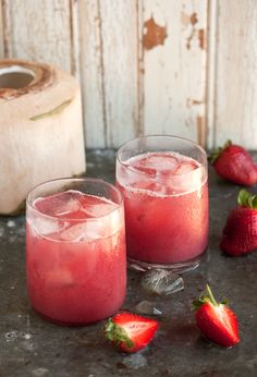 two glasses filled with ice and strawberries