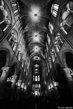 black and white photo of the inside of a cathedral