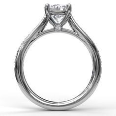 a white gold engagement ring with a princess cut diamond on the center and side stones