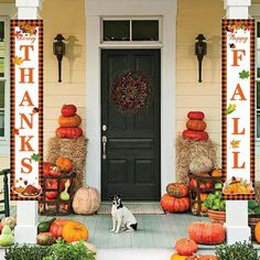 a front porch decorated with pumpkins and hay bales