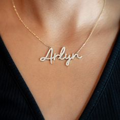 14K Solid Gold Diamond Personalized Name "Arlyn" Adjustable Rolo ChainMade from high-quality 14K gold, this necklace exudes luxury and sophistication. The delicate Rolo chain adds a touch of finesse to the design, creating a piece that effortlessly enhances any outfit, whether it's for everyday wear or special occasions.Weight: 5.8 gMaterial: 14K Yellow GoldLength: 16"-17" Adjustable- 20mm Long PendantWidth: 2" PendantDiamonds: 115 x 0.005Ctw=0.58CtwColor and Clarity: H/I1Total Carat Weight: 0.5 Elegant Personalized Yellow Gold Chain Necklace, Elegant Gold Name Necklace With Cable Chain, Personalized White Gold Elegant Chain Necklace, Personalized Elegant White Gold Chain Necklace, Formal Elegant Name Necklace With Diamond Accents, Elegant Yellow Gold Name Necklace With Delicate Chain, Luxury Diamond Name Necklace For Formal Occasions, Elegant Personalized 14k Gold Diamond Necklace, Elegant Gold Name Necklace With Diamond Accents