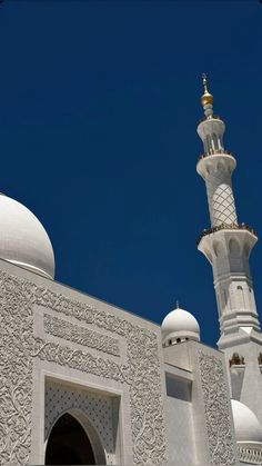 an ornate white building with a gold dome