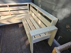 a wooden bench sitting on top of a wooden deck